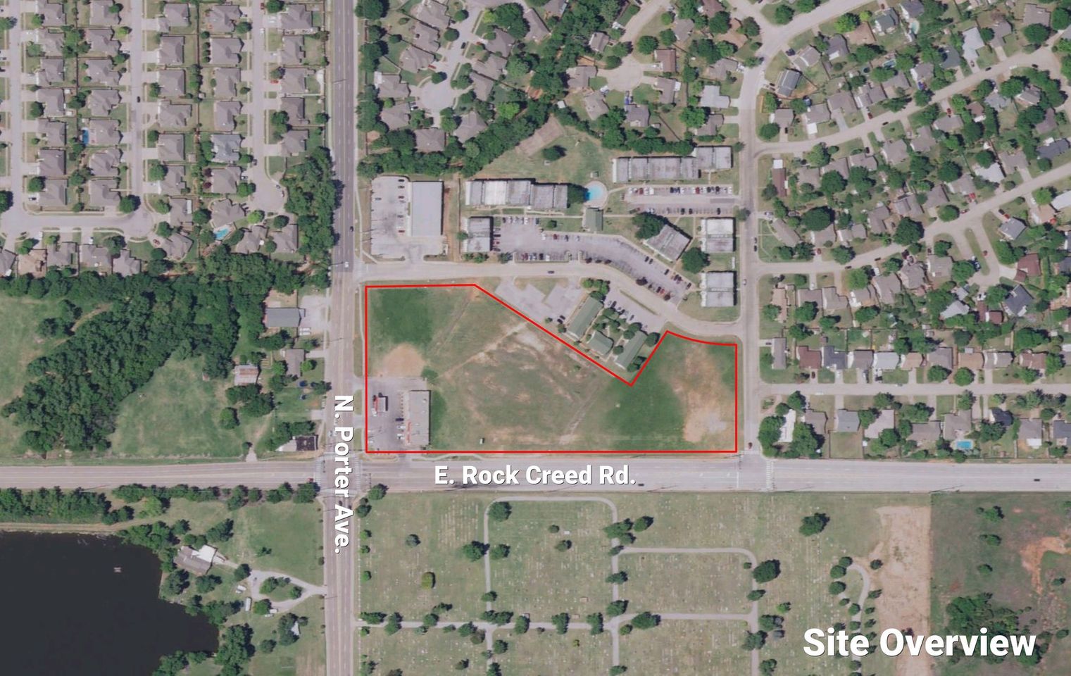 Labeled aerial of the parcel outlined in red at N. Porter Avenue and E. Rock Creek Road, near apartments and a cemetery.